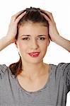 Teen woman with headache holding her hand to the head, isolated on white