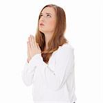 Closeup portrait of a young caucasian woman praying , isoalted on white