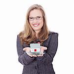 Beautiful young businesswoman holding euros bills and house model over white - real estate loan concept