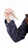 Young businesswoman (real estate agent) with house keys in hand