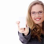 Businesswoman in suit holding blank empty businesscard. Isolated