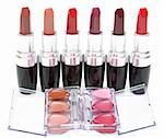 Lipstick stands in row and openning box with make-up on white background