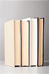 group of closed books on gray background