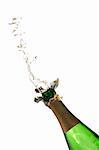 Bottle of champagne with splashes over white background