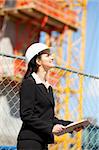 Woman looking up at construction site