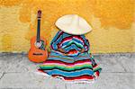 Mexican typical lazy man sombrero hat guitar serape nap siesta
