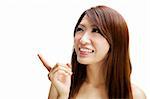 Asian woman pointing to empty space, ready for text.
