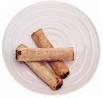 Spring Roll Appetizer on a Pink Plate Isolated on White with a Clipping Path.