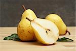 A few pears in a still life scene.