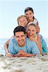 Portrait of a smiling famiy at the beach