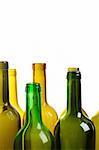 Many empty green wine bottles isolated on white background