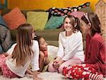 Four excited little girls together for a sleepover party