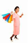 Beautiful African-american woman with shopping bags, giving the thumbs-up sign.  Full body isolated on white.
