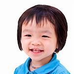 Close-up shot of a little Asian girl with smile on her face.