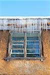 Windows Beneath Icicles, rural winter house detail