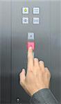 businessman hand press 3 floor in elevator