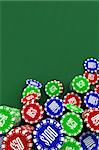 Loads of poker chips over green background