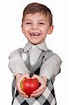 Little boy with apple. Isolated on white background.