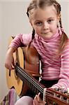 Young girl play classical guitar