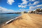 Fantastic image of a town beach with blue sky