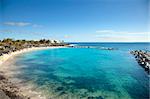 Tropical beach with white sand and blue sky