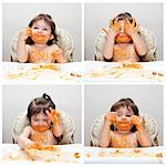 Happy baby having fun eating messy showing hands covered in Spaghetti Angel Hair Pasta red marinara tomato sauce.