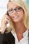 Attractive young business women calling by cellular phone