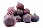 One fig against the background of many figs, isolated on a white background