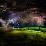 Tornado in stormy landscape