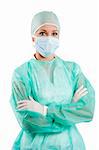 young beauty nurse in green operation dress with surgery cap and mask posing