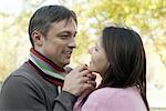 happy beautiful couple in a autumn park