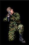 Soldier with weapon, isolated on black background