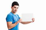 Young guy holding a blank bill board isolated on white background