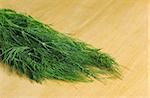 Fresh dill on wooden board (Selective Focus)