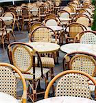 Street view of a Cafe terrace with empty tables and chairs,paris France