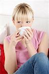 Young beautiful woman having coffee or tea