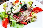 Fresh salad - Delicious fresh salad with tomatoes, lettuce, eggplant, zucchini, cheese, parma ham and olive oil.