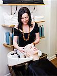 Hairdresser washing customers hair at a Beauty Spa