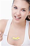 Attractive young girl with corn flakes