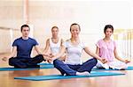 A group of young people in the lotus position