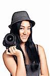 A young asian girl posing and smiling with an SLR camera.