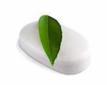 White soap bar with green leaf isolated on white background.