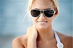 Sexy blond girl posing on a beach