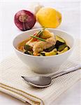 photo of delicious fish soup with cod and zucchini