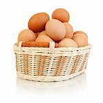Eggs in basket isolated on white white background
