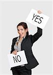 Business young woman choosing the Yes choice, over a white background