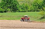 tractor trails with ground and grass background representing agriculture concept