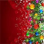Christmas background with snow-covered Christmas tree decorated with glass balloons