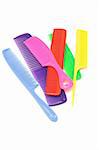 Assortment of colorful plastic combs on white background