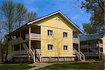 Wooden cottage in spring forest camp